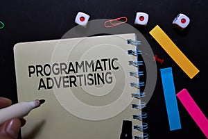 Programmatic Advertising text on book isolated on office desk photo