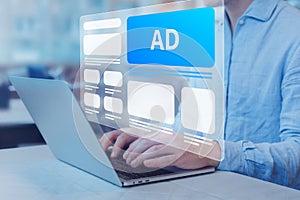 Programmatic in-feed advertisement on computer screen. Person viewing website with inbound ads to optimize click through rate and photo