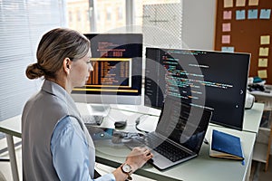 Programmer Checking Code on Screen