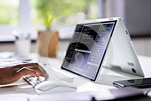 Programmer Or Coder At Office Desk