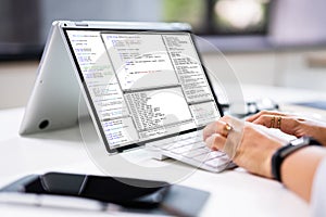 Programmer Or Coder At Office Desk