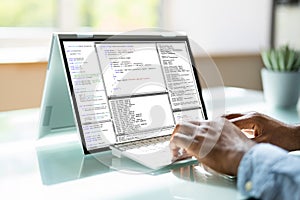 Programmer Or Coder At Office Desk