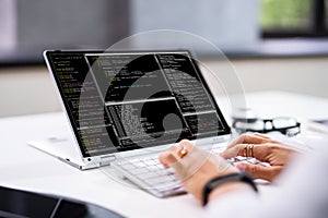 Programmer Or Coder At Office Desk