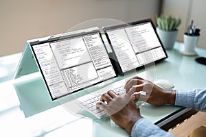 Programmer Or Coder At Office Desk