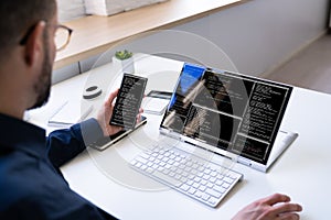 Programmer Or Coder At Office Desk