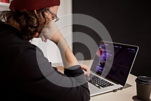 Programmer and coder working in the development environment. Programmer`s workplace