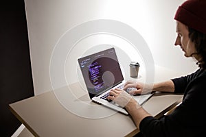 Programmer and coder working in the development environment. Programmer`s workplace