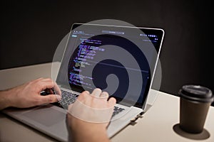 Programmer and coder working in the development environment. Programmer`s workplace