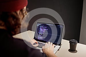 Programmer and coder working in the development environment. Programmer`s workplace