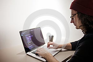 Programmer and coder working in the development environment. Programmer`s workplace