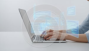 Programmer coding software on laptop with virtual interface