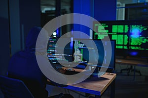 Programmer or computer hacker typing code