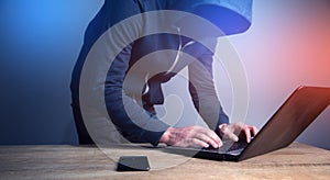Programmer or computer hacker typing code