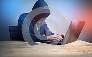 Programmer or computer hacker typing code