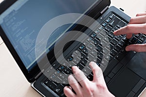 Programmer courses typing code laptop software