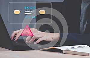 programmer, developer using computer laptop with triangle caution warning sign for notification error and maintenance concept.