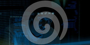 Programmer or Developer working in dark room with computer code reflected on their monitor