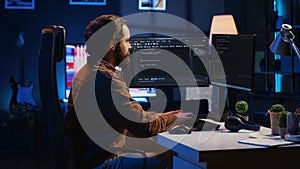 Programmer developing code on computer screen while in personal office