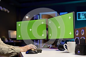 Programmer developing software applications using green screen computer