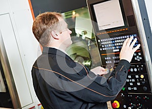 Programmer engineer with metal working machine