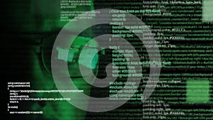 Programmer or hacker in glasses - software code reflecting in