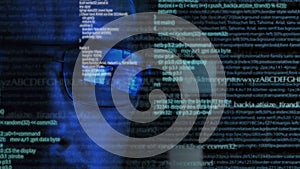 Programmer or hacker in glasses - software code reflecting in