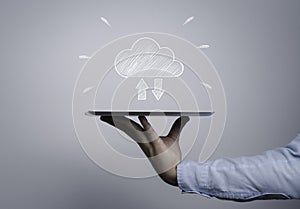 Programmer holding computer tablet with cloud computing drawing icon for upload and download information , Technology innovation