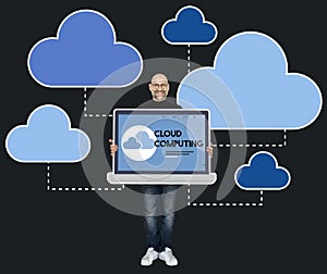Programmer holding a laptop with cloud computing