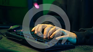 Programmer man keyboard computer typing hacker internet networking online professional software cyber tech security pc