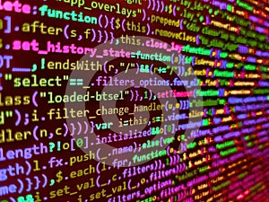 Programmer occupation. Code on dark background. Front-end applications in the color concept. Programming code abstract technology