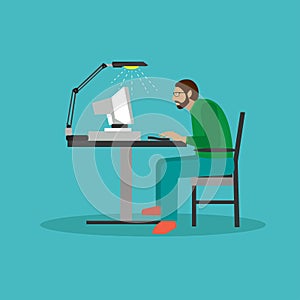 Programmer sit on a chair and working with computer.