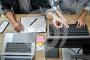Programmer Team of  Developing programming and website working in a software develop company office, writing codes and typing data