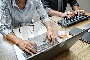 Programmer Team of  Developing programming and website working in a software develop company office, writing codes and typing data