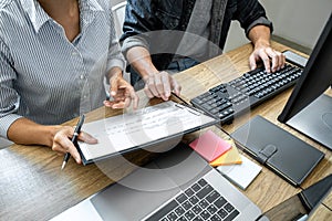 Programmer Team of  Developing programming and website working in a software develop company office, writing codes and typing data
