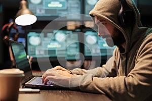Programmer thief hacking security system on computer