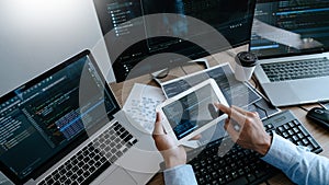Programmer Typing Code on desktop computer, Developing programming and coding technologies concept