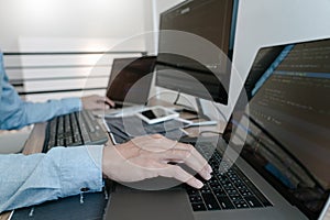 Programmer Typing Code on desktop computer, Developing programming and coding technologies concept