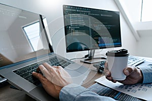 Programmer Typing Code on desktop computer, Developing programming and coding technologies concept