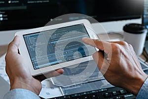Programmer Typing Code on desktop computer, Developing programming and coding technologies concept