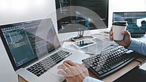 Programmer Typing Code on desktop computer, Developing programming and coding technologies concept