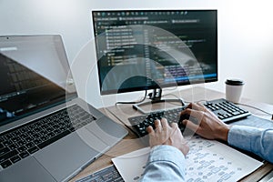 Programmer Typing Code on desktop computer, Developing programming and coding technologies concept