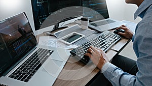 Programmer Typing Code on desktop computer, Developing programming and coding technologies concept