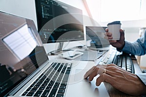 Programmer Typing Code on desktop computer, Developing programming and coding technologies concept