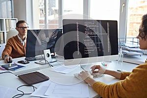 IT Programmer Using Computer in Office