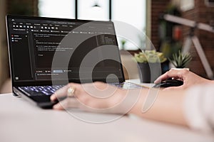 Programmer using terminal window with code