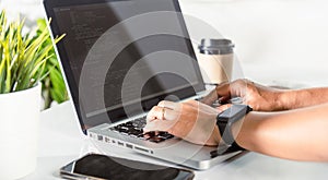Programmer woman writing program HTML code sitting at workplace in office