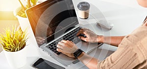 Programmer woman writing program HTML code sitting at workplace in office