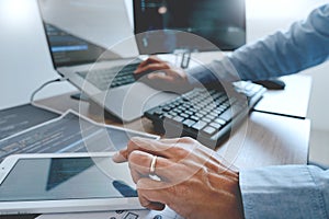 Programmer working On Computer In IT Office Typing Data Coding in software and checking code on computer screen