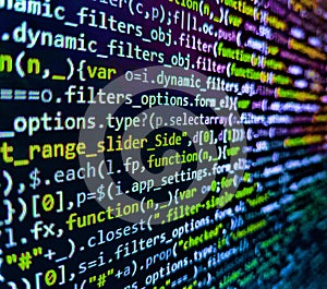 Programmer working in computer screen. Software developer programming code on computer monitor. Closeup of Web Code on Computer