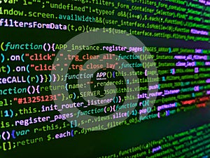 Programmer working on computer screen. Vignette light and dark shadow dramatic effect. Programming Javascript on laptop computer